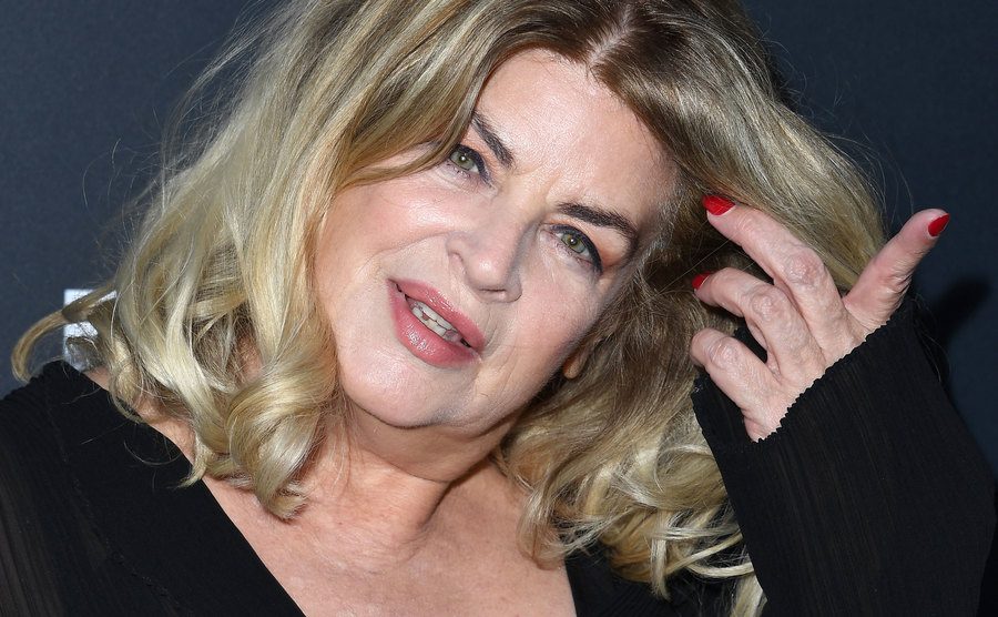 Kirstie Alley poses for the press.