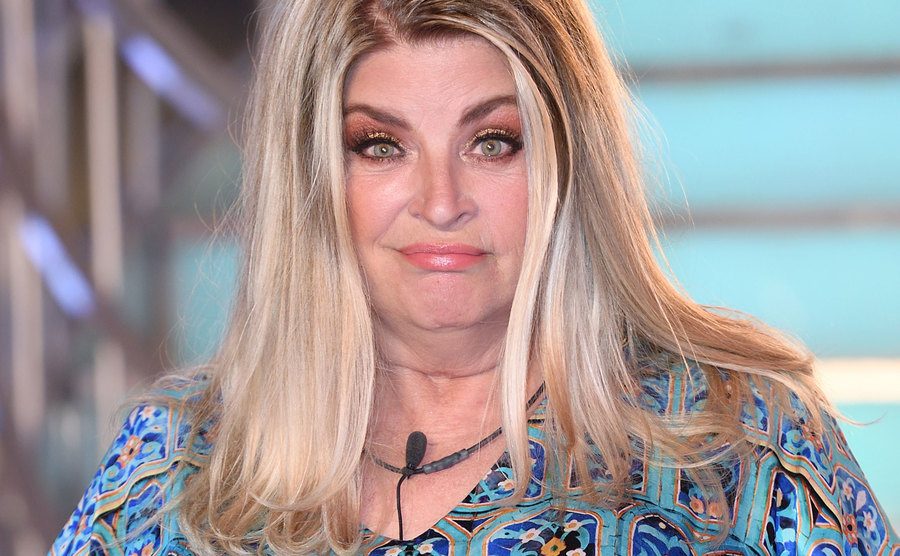 Kirstie Alley poses for the press.