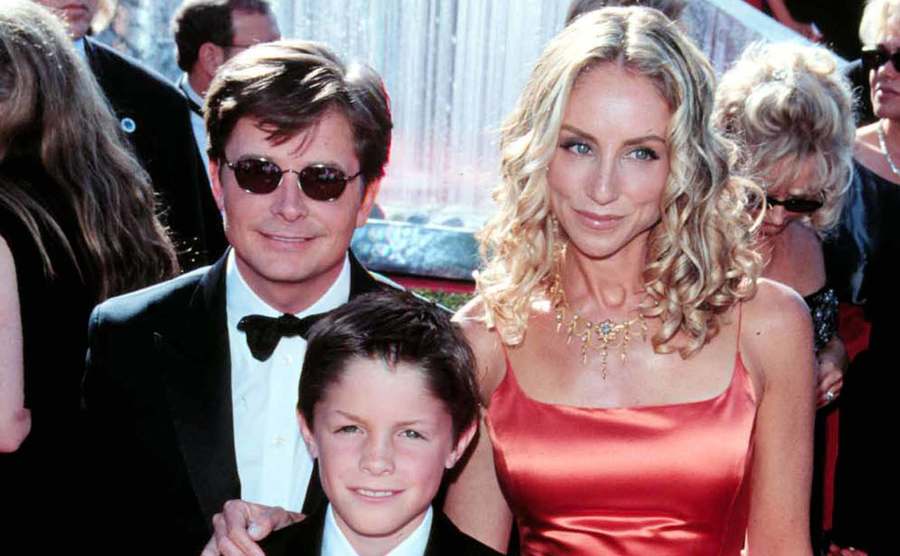 Fox, Tracy Polland, and their son attend an event.