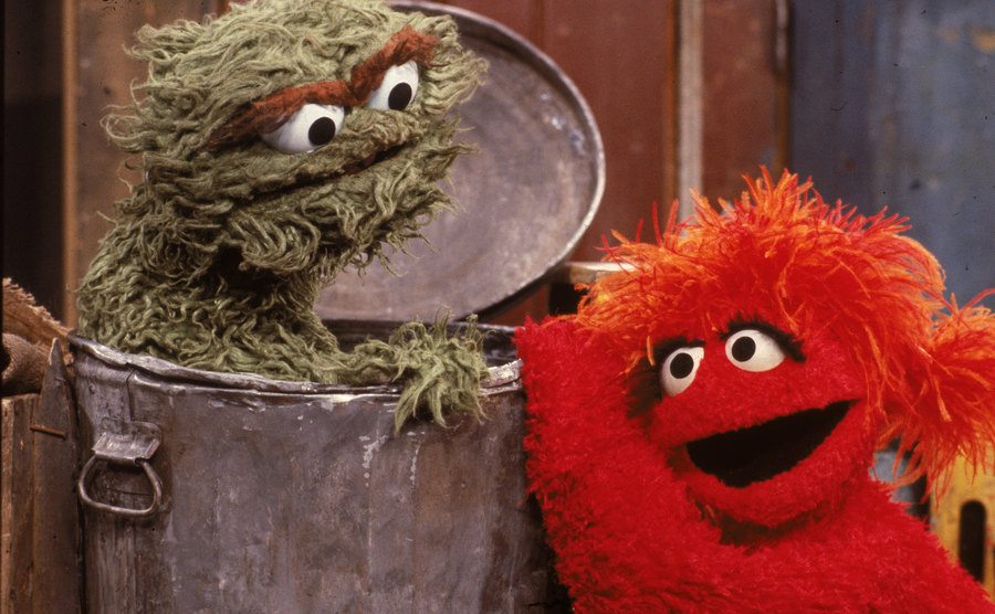 Oscar the Grouch is inside his garbage can.