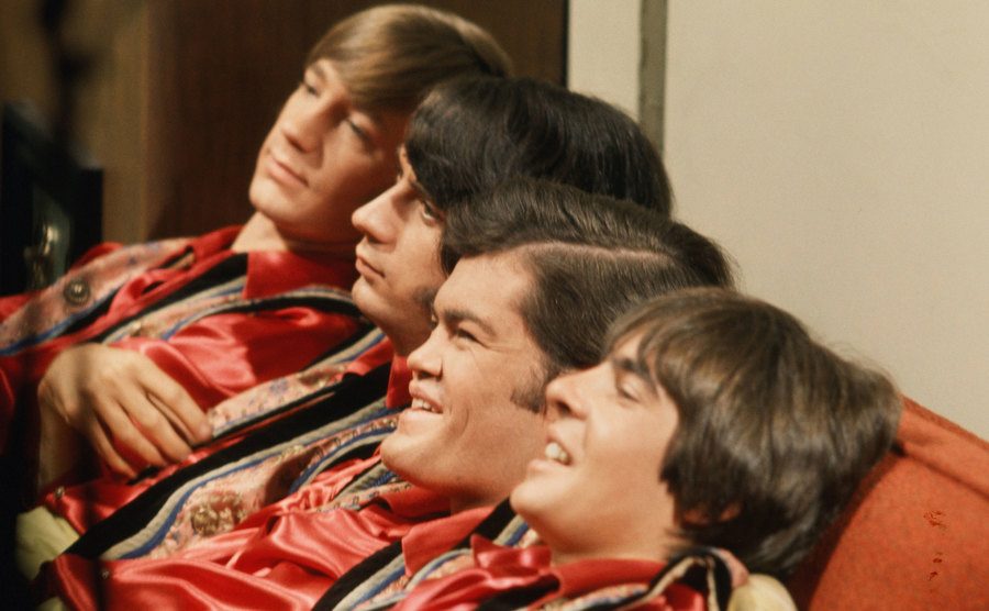 Davy Jones, Mickey Dolenz, Peter Tork, and Mike Nesmith on the television show set.