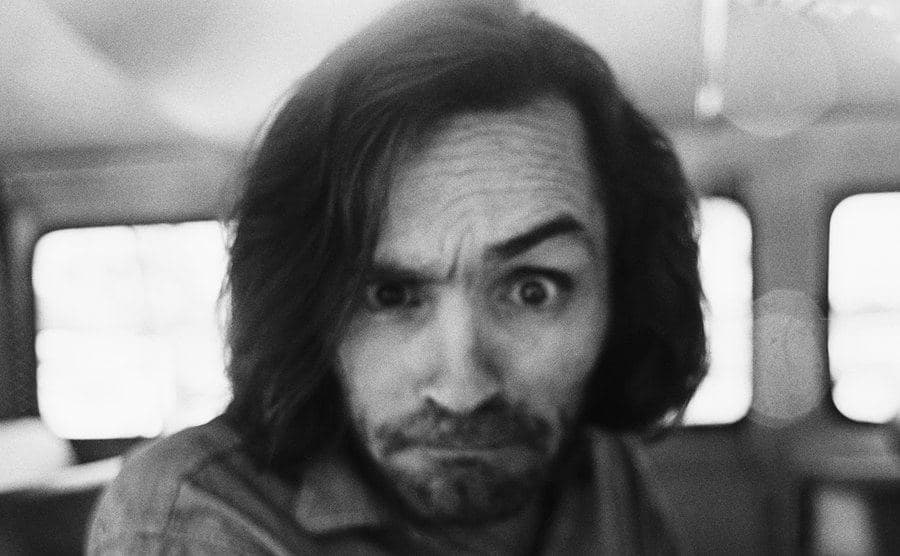 A portrait of Charles Manson.