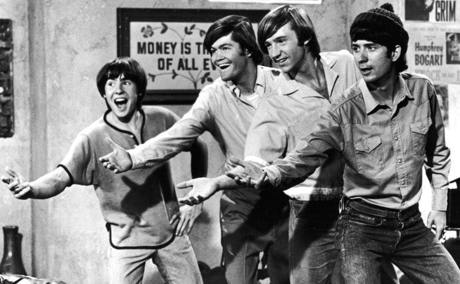 The Monkees sing in a still from the show.