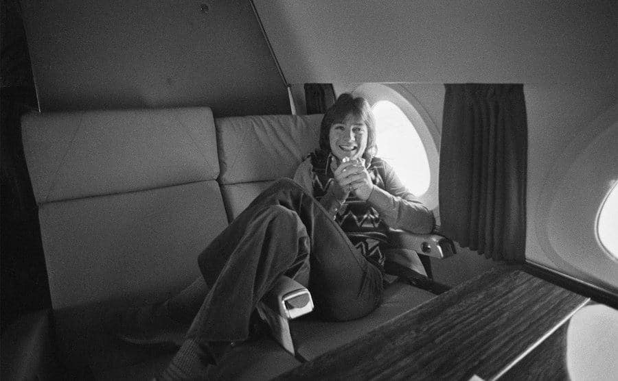 David Cassidy has a drink while on a private jet. 