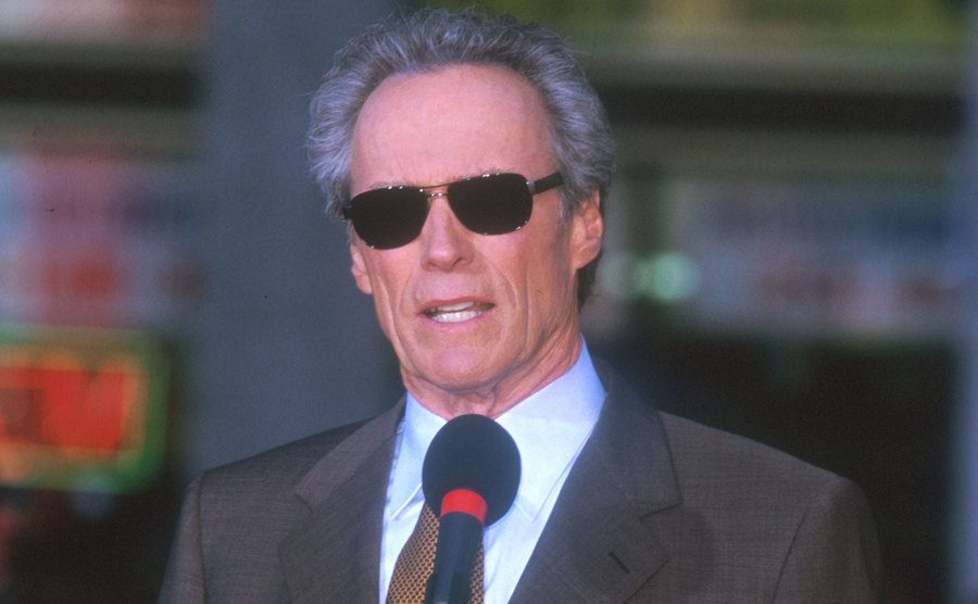 Clint Eastwood speaks at a microphone.
