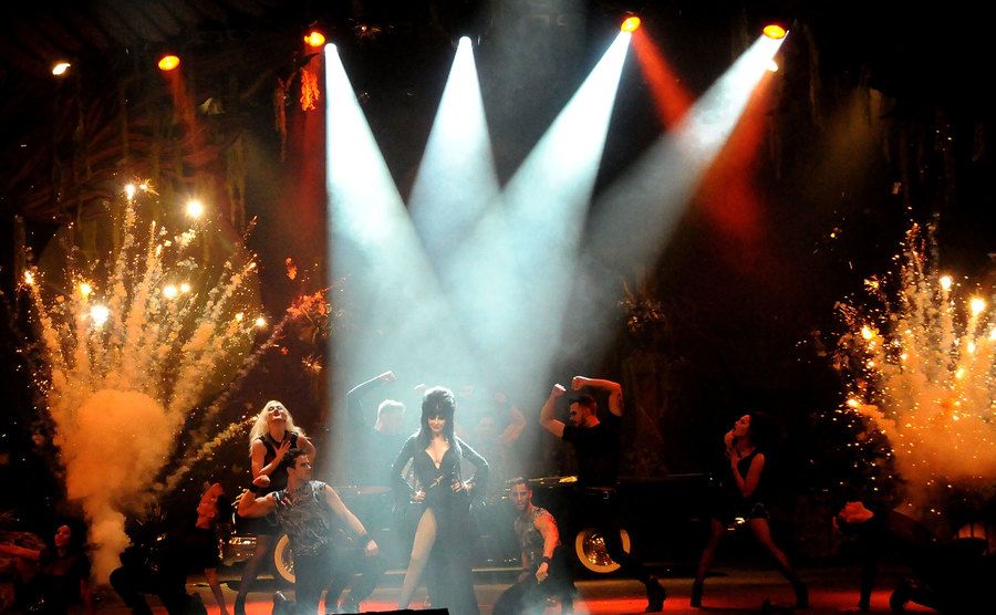 Elvira performs on stage.