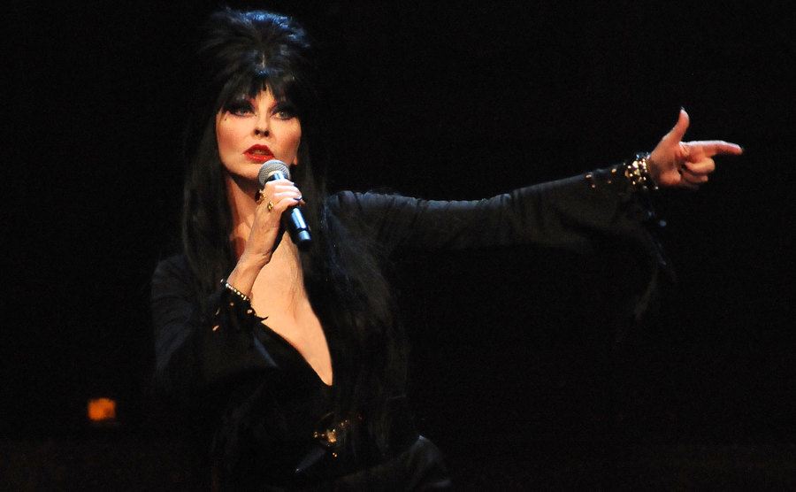 Elvira performs on stage.