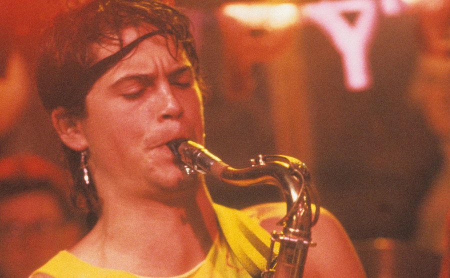 Rob Lowe plays the saxophone in a scene from the film.