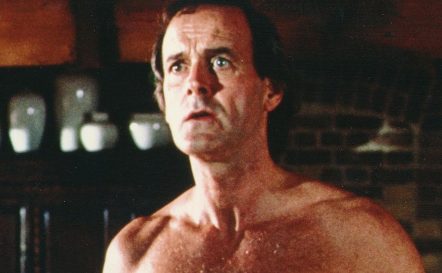 John Cleese looks astonished in a still from the film.