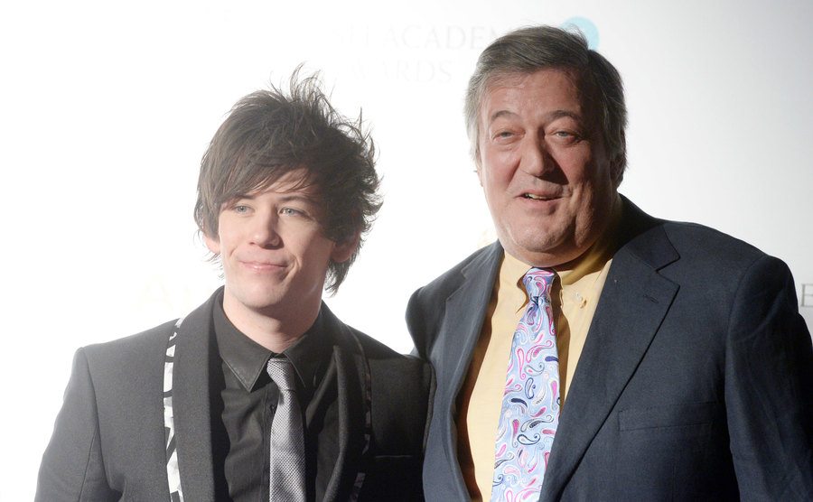 Stephen Fry attends an event with his partner.