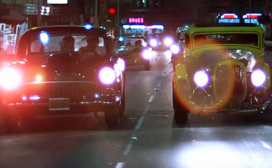 A car race scene in a still from the film.