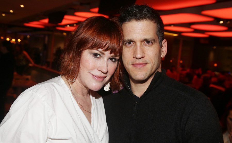 Molly Ringwald and her husband Panio Gianopoulos attend an event.