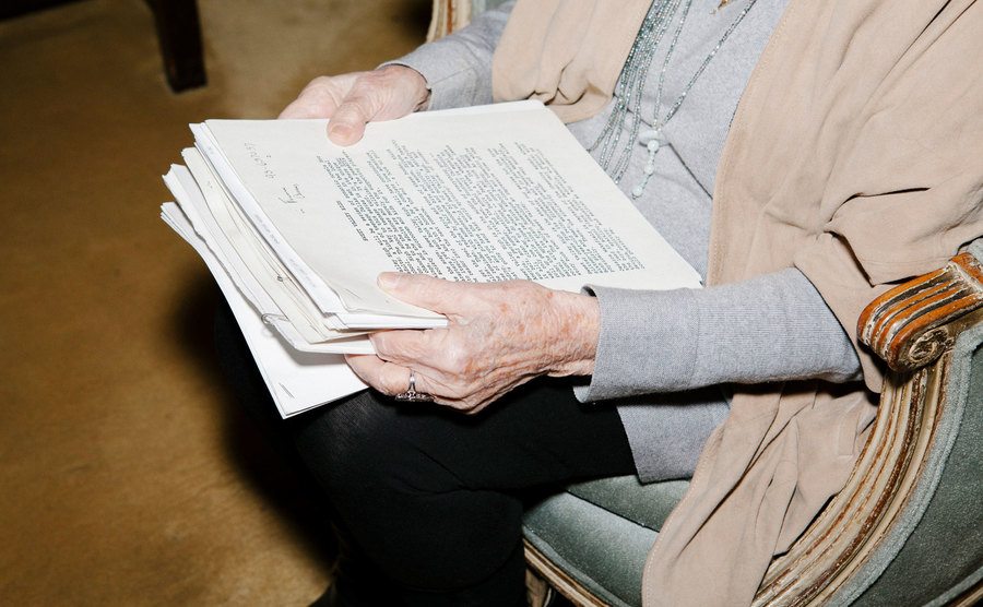 A photo of Francine holding Sweet Valley High original scripts.