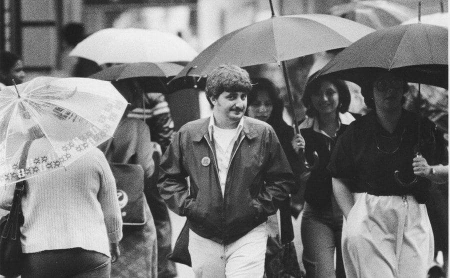 A photo of John Wojtowicz walking the street.
