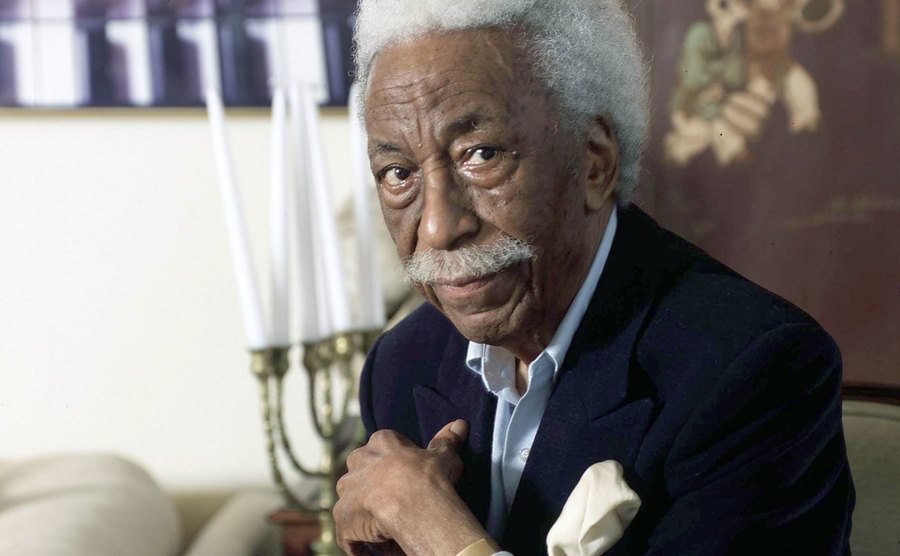 A portrait of Gordon Parks in his home.