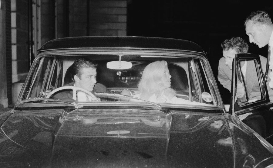 A dated image of Dawson and his Diana Dors talking to friends from their car.