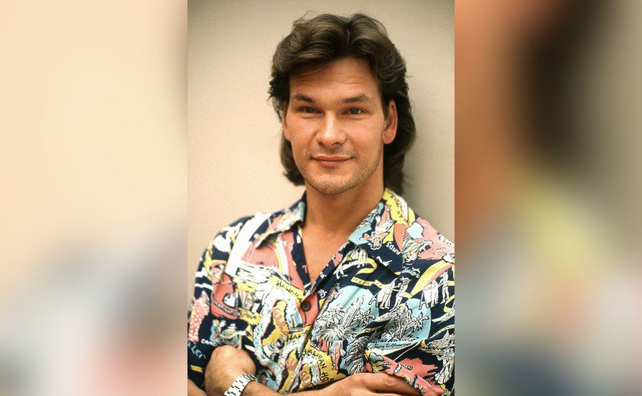 Patrick Swayze poses for a portrait at home. 