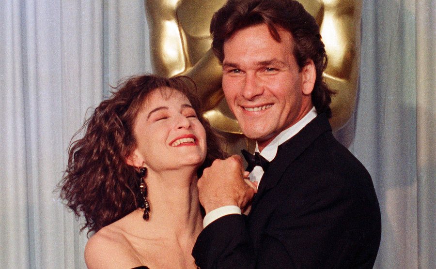 A photo of Grey and Swayze backstage at the Academy Awards.