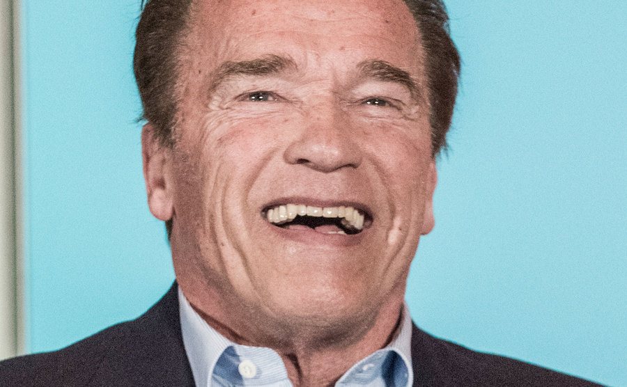 Arnold laughs during an interview.