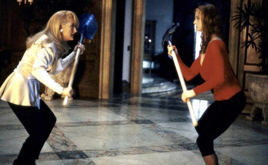 Streep and Hawn swing shovels at each other. 