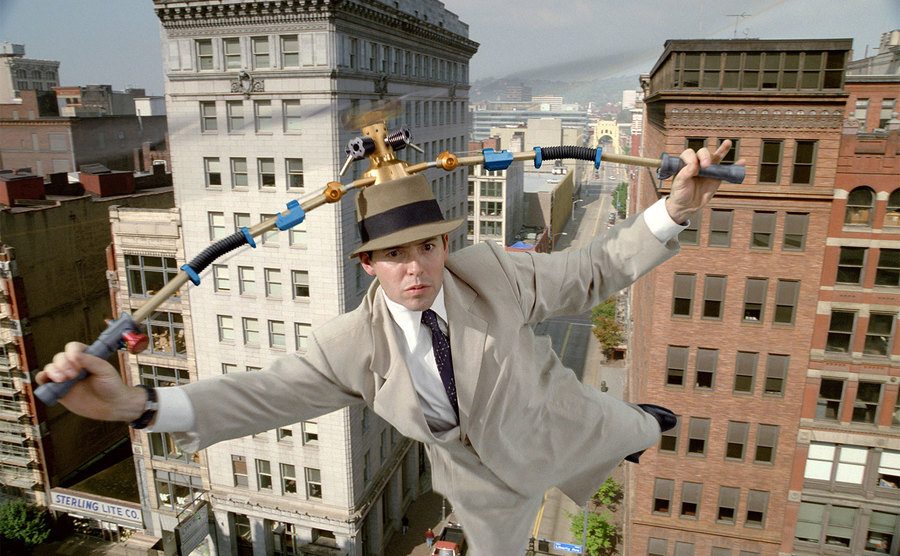 Matthew Broderick flies through the air as Inspector Gadget. 