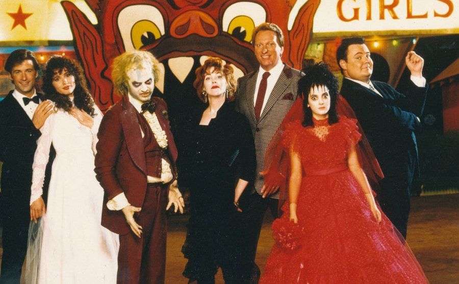 The cast of Beetlejuice poses in costume. 