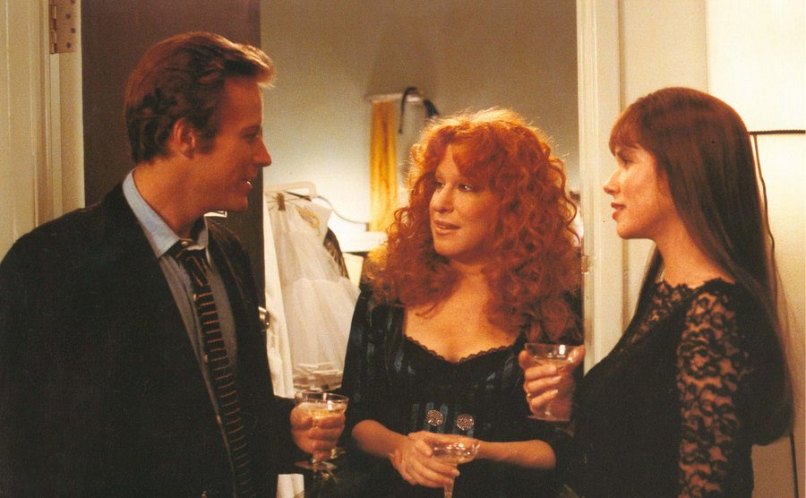 A still of John Heard, Bette Midler, and Barbara Hershey in a scene from Beaches.