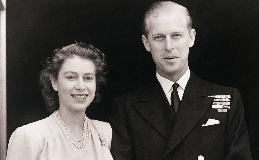 Queen Elizabeth II and Prince Philip pose together after their engagement. 