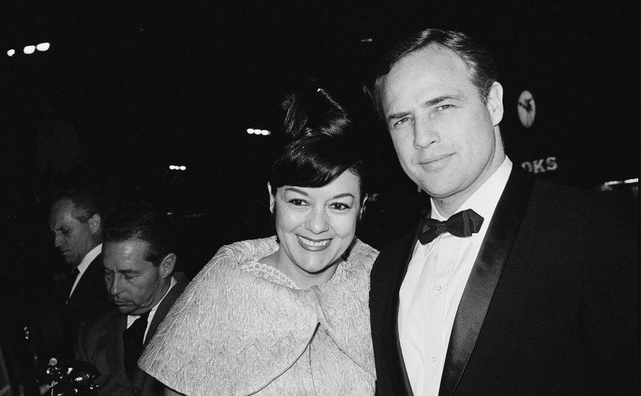 Marlon Brando and Movita Castaneda attend a premiere. 