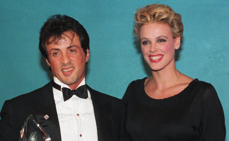Sylvester Stallone and his wife Brigitte Nielson are all smiles as he displays his People's Choice award.