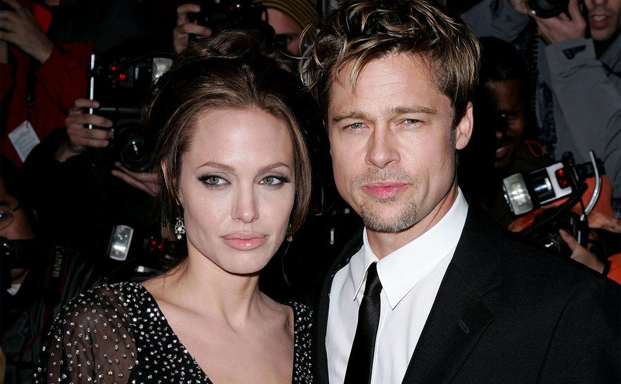 Angelina Jolie and Brad Pitt attend a premiere. 