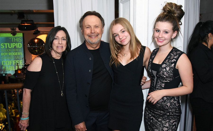 Janice Crystal, Billy Crystal, and their daughters attend an event. 