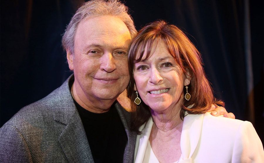 Billy Crystal and wife Janice Crystal pose backstage. 
